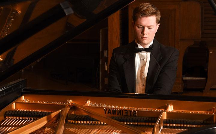 Photo showing student playing Steinway
